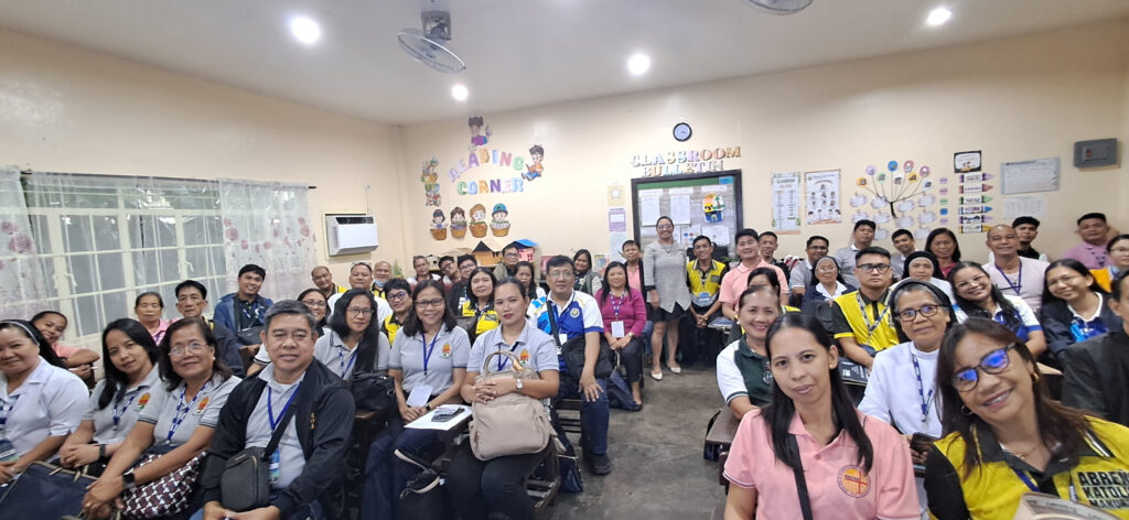 Dr. Apiles posing with the school heads during the CEAP Regional Meet