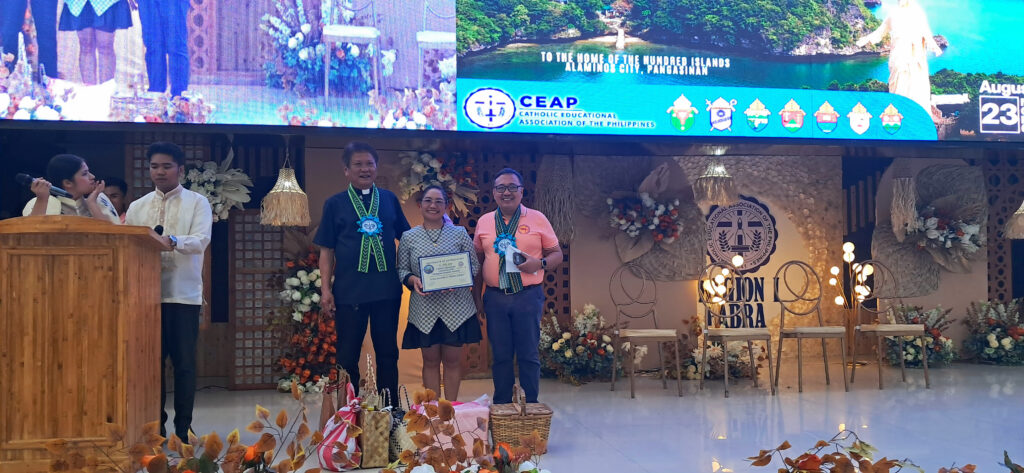 Dr. Apiles being honored with a certificate of recognition during the CEAP Regional Meet