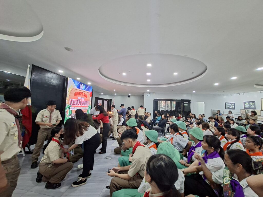 The Boy Scouts during the Donning of Neckerchief with their parents.