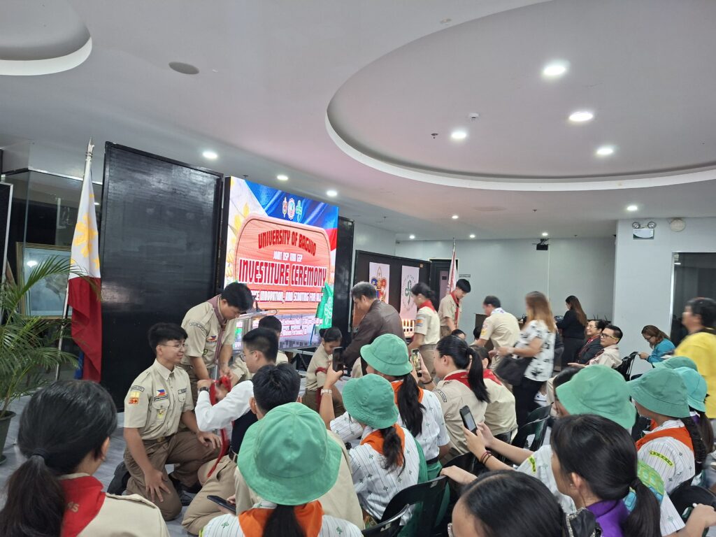 The Boy Scouts during the Donning of Neckerchief with their parents.