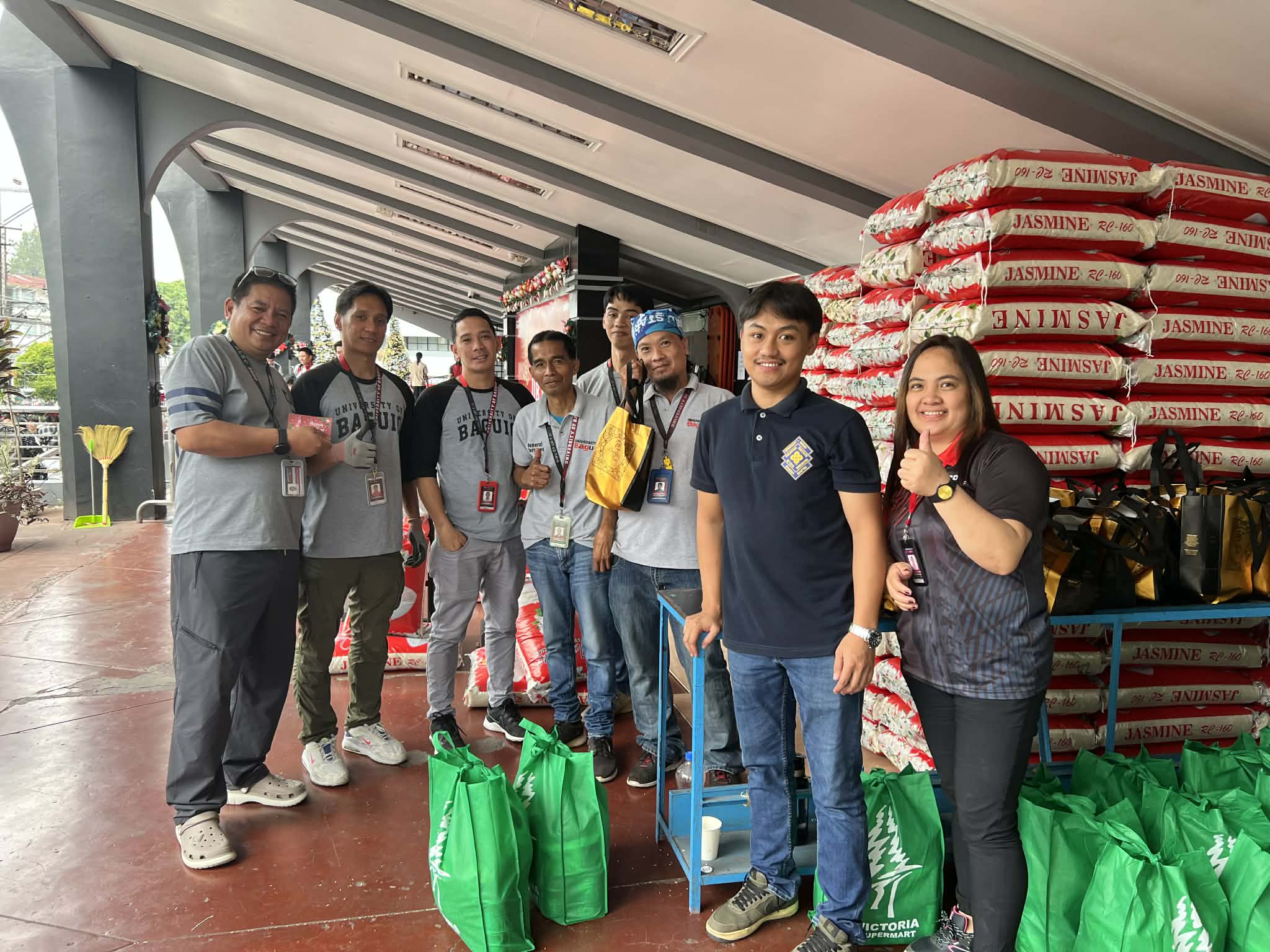The UB staff as they distribute the allocated rice and groceries for the holidays.